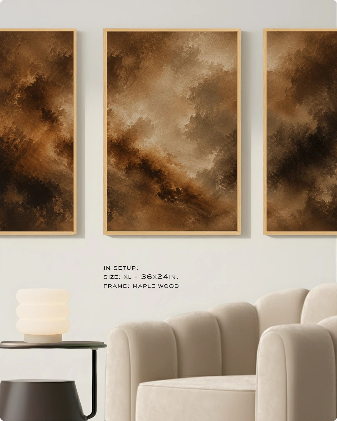 Three vertical framed abstract wall art prints in warm brown and gold tones, displayed above a cream sofa in a modern living room setting.