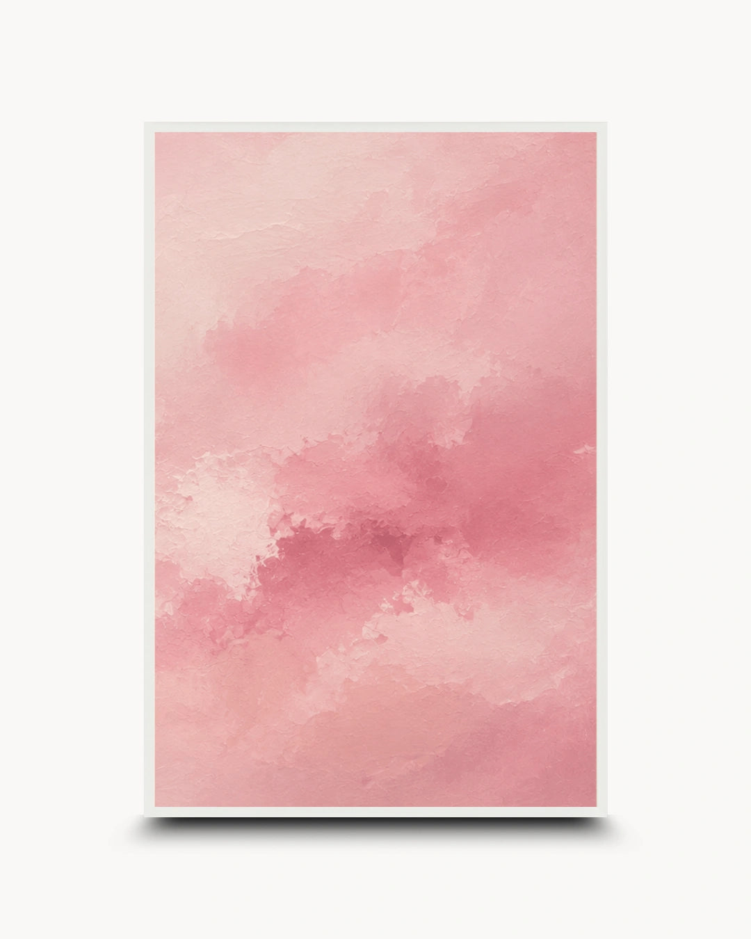 A vertical framed art print featuring a soft pink watercolor texture with cloudy, blended tones, shown against a light gray background with a subtle drop shadow.