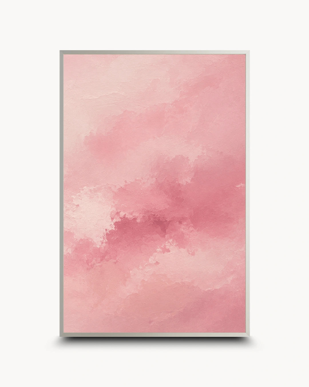 A vertical framed art print featuring a soft pink watercolor texture with subtle cloud-like or smoky tonal variations, shown against a light gray background with a drop shadow.