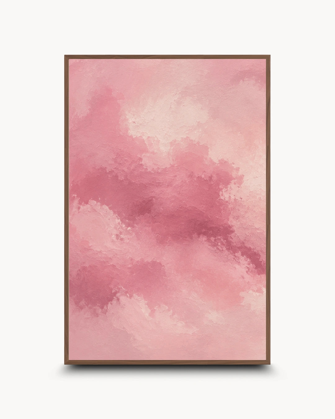 A framed abstract art print featuring a watercolor-style pink cloud pattern, set against a clean white background with a subtle drop shadow.