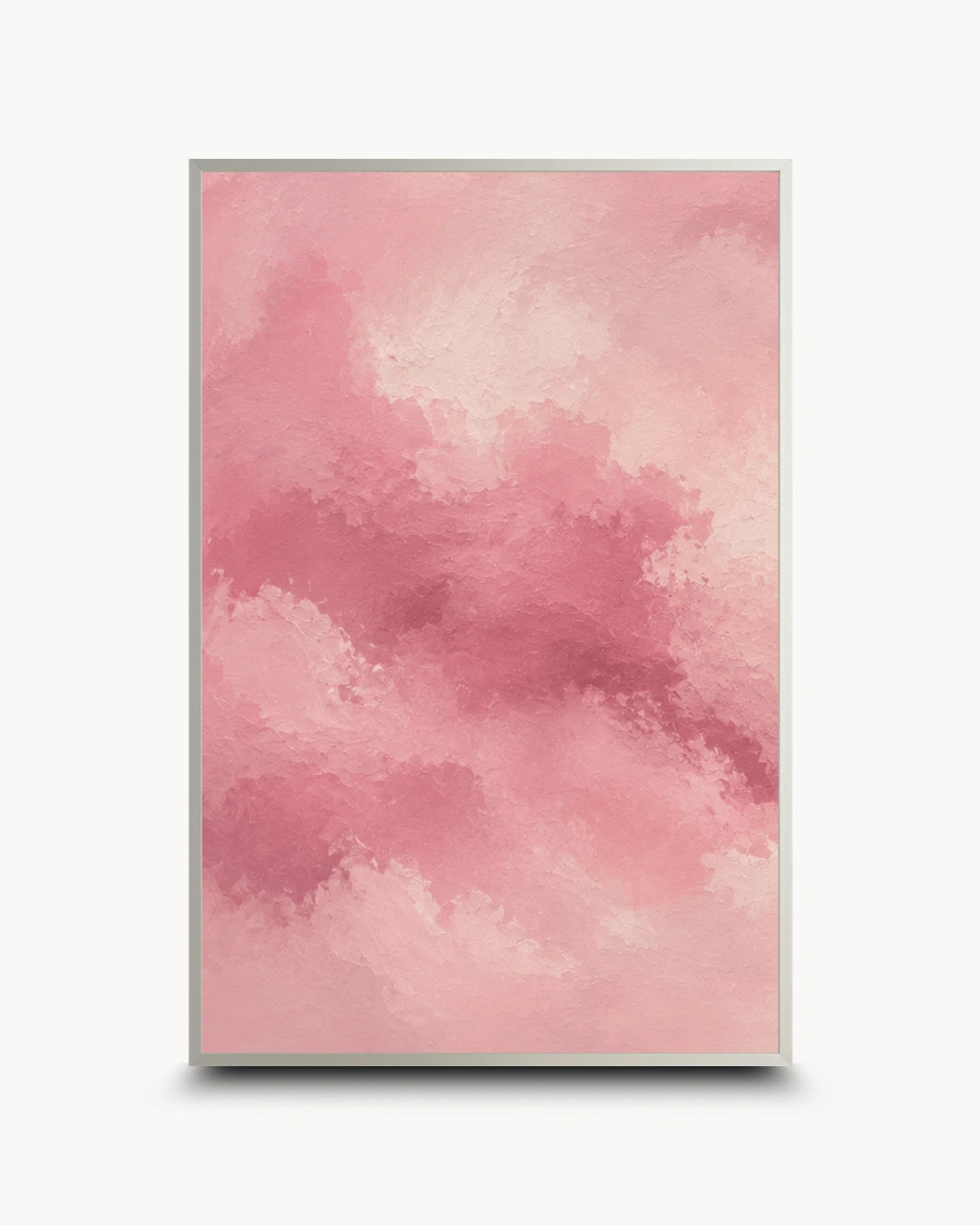 A vertical framed art print featuring a soft pink watercolor cloud pattern, displayed against a clean white background with a subtle drop shadow.