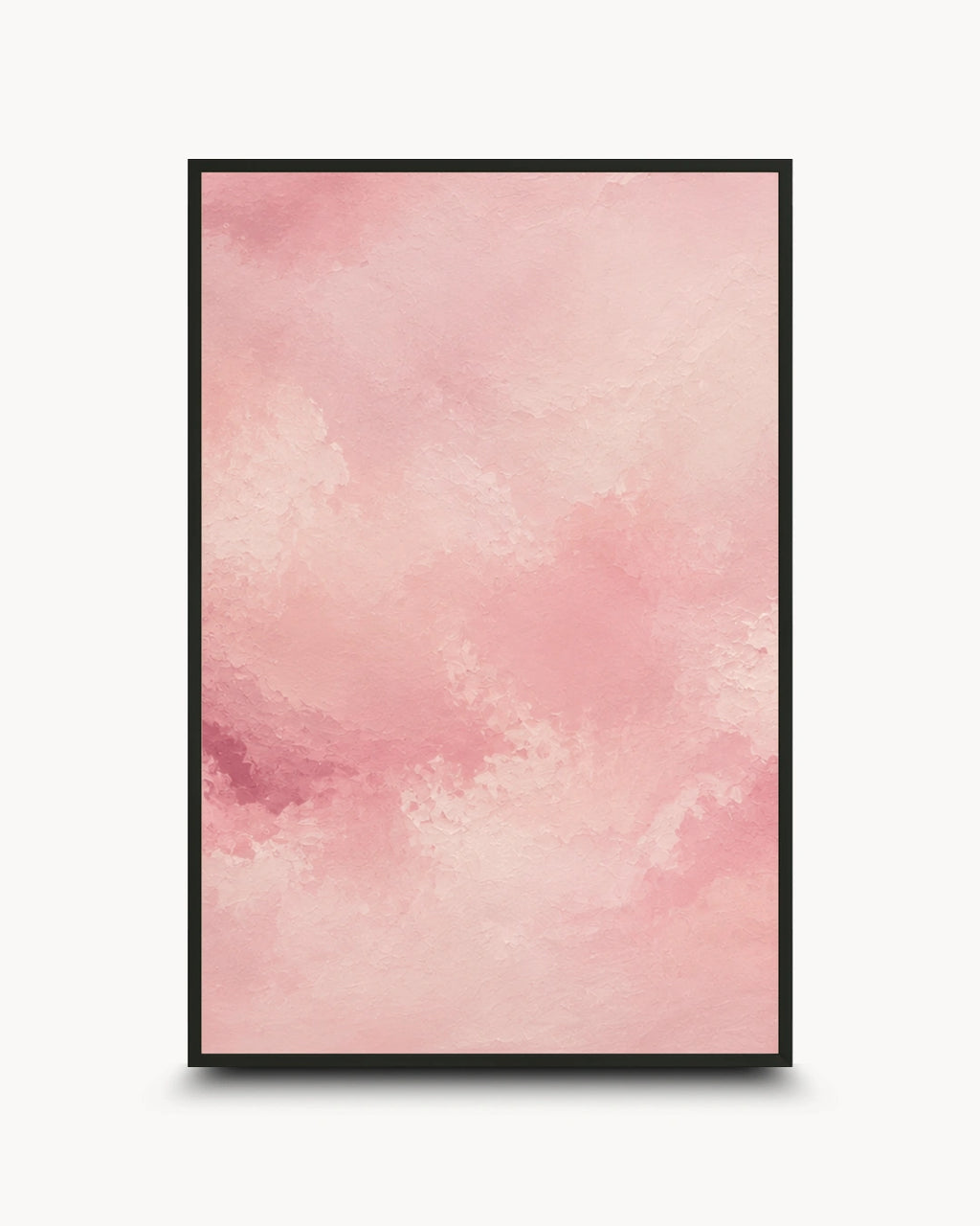 A vertical framed art print featuring a soft pink watercolor texture with subtle tonal variations, presented in a thin black frame against a light gray background.
