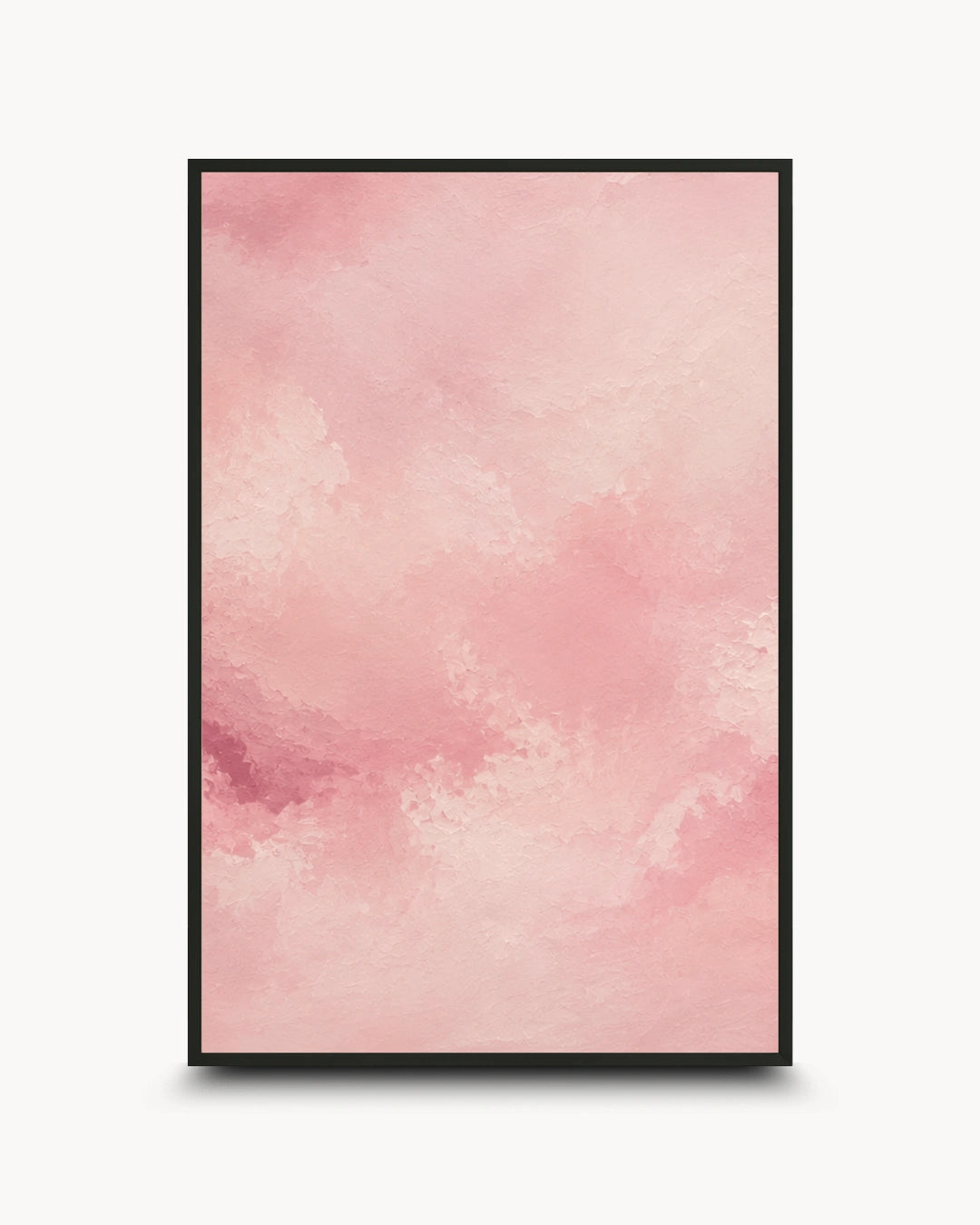 A vertical framed art print featuring a soft pink watercolor texture with subtle tonal variations, presented in a thin black frame against a light gray background.