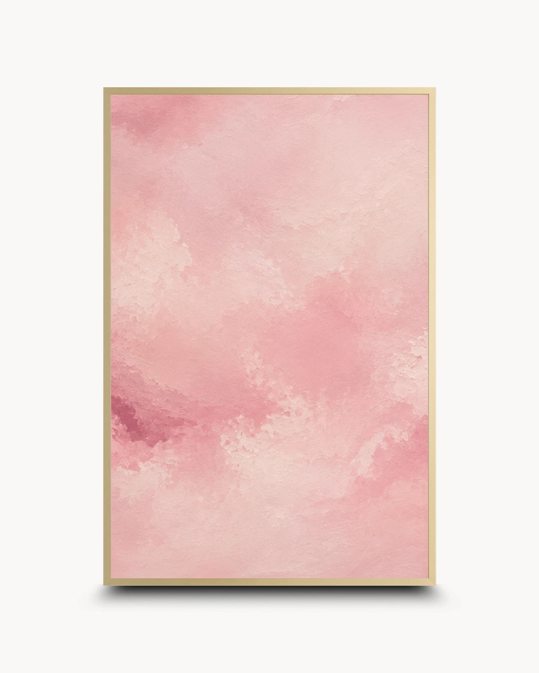 A vertical framed art print featuring a soft pink watercolor texture with a thin gold frame, shown against a clean white background with a subtle drop shadow.