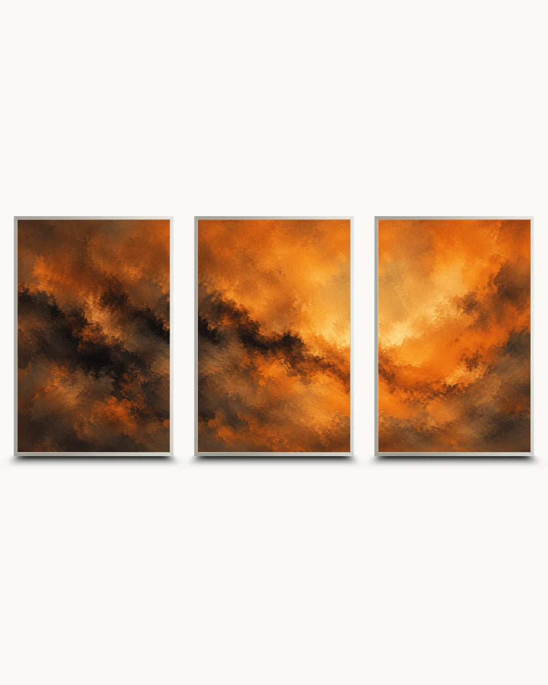 A three-panel framed wall art set featuring dramatic orange and brown cloudy or fiery abstract imagery, displayed against a light gray background.