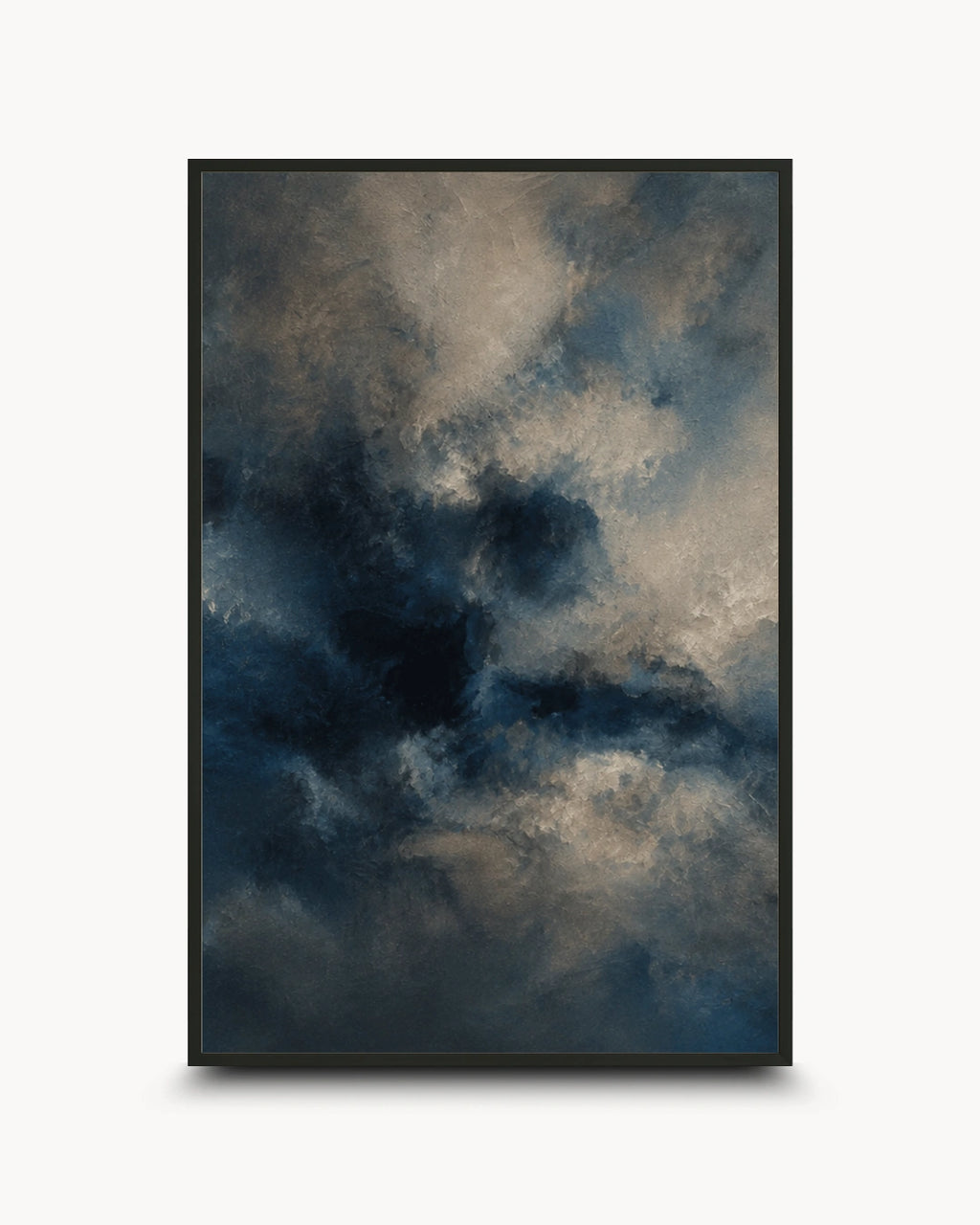 A framed vertical art print featuring an abstract, painterly sky scene in deep navy, charcoal, and warm beige tones, shown against a light gray background.