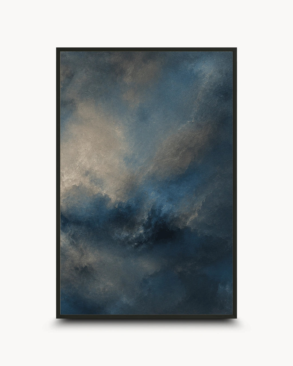 A framed abstract art print featuring a dramatic, textured sky-like composition in deep blue, charcoal gray, and muted beige tones, displayed against a clean white background.