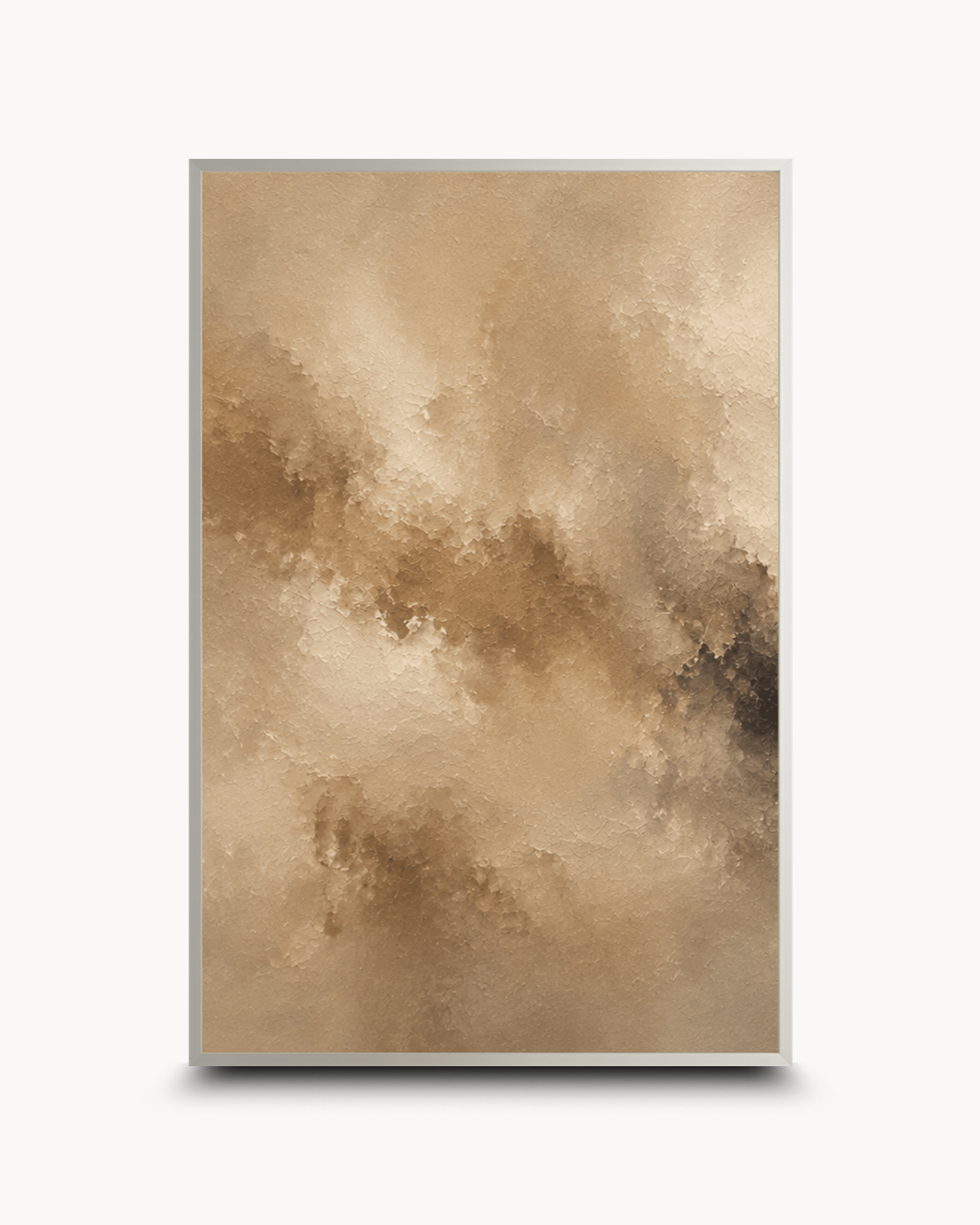 A vertical framed abstract art print featuring a textured, fluid composition in warm beige, tan, and brown tones with a thin gold-toned frame, shown against a clean white background.