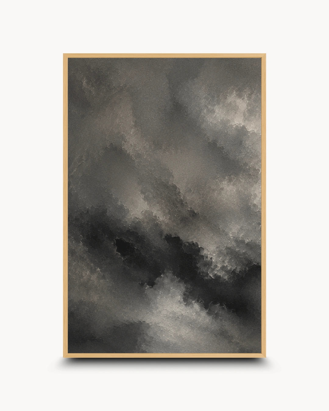 A framed abstract art print featuring a dramatic, textured cloud-like composition in shades of charcoal gray, black, and off-white, set against a clean white background.