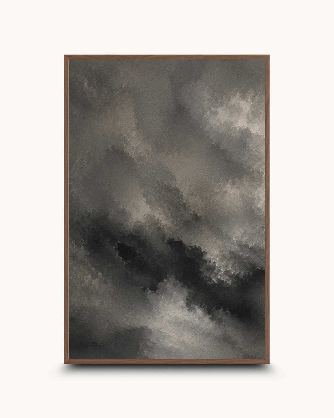 A framed abstract art print featuring a dramatic, textured cloud-like composition in shades of charcoal gray, black, and off-white, set against a clean white background.
