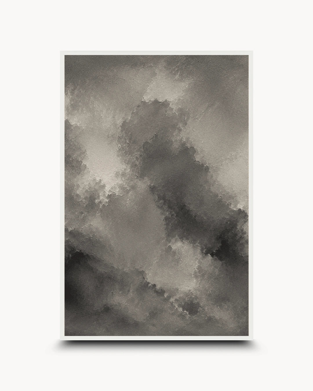 A framed abstract art print featuring a textured, painterly cloud-like composition in shades of gray, black, and white, displayed against a clean white background with a subtle drop shadow.
