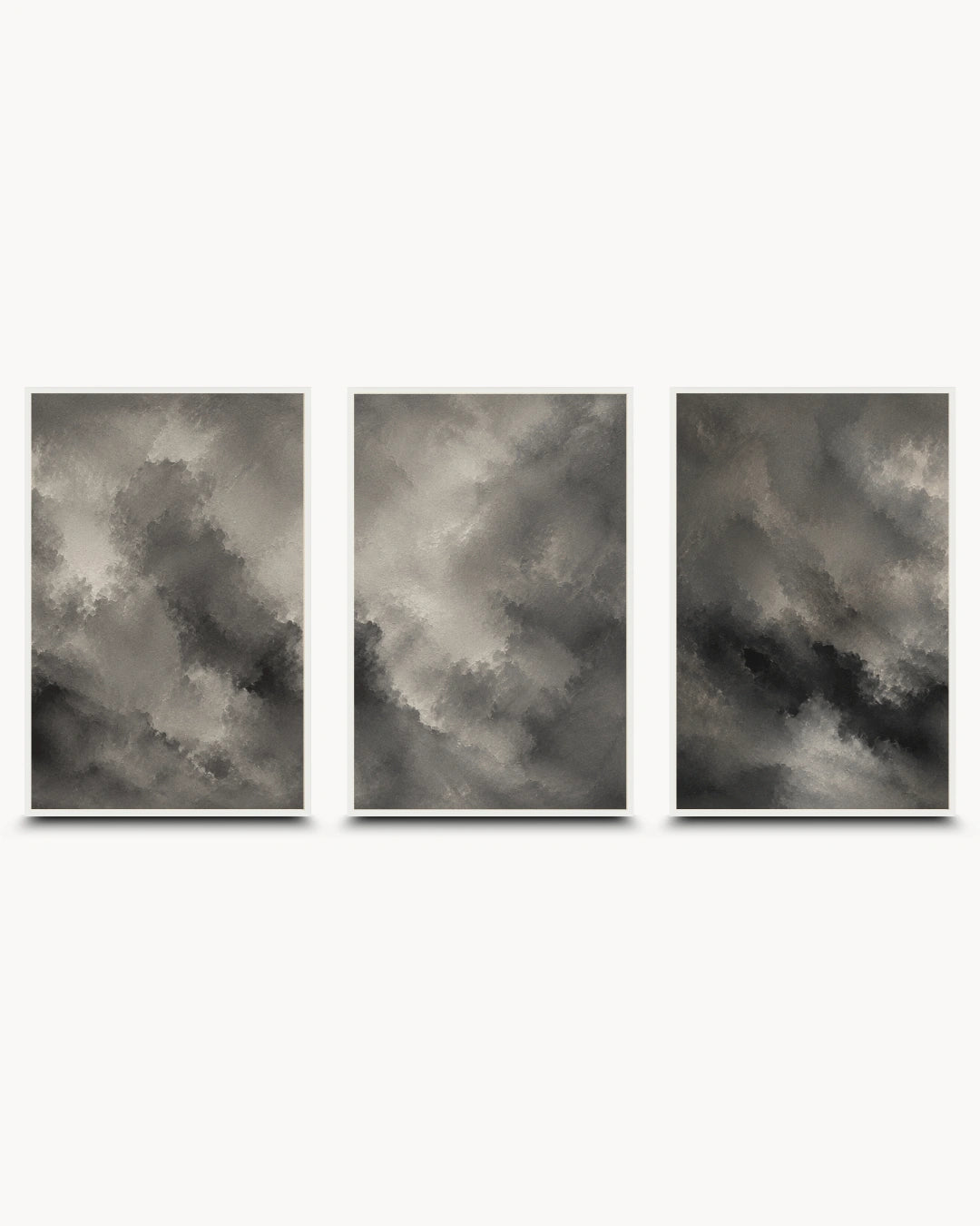A three-panel wall art set featuring dramatic gray and black storm clouds, displayed against a clean white background.