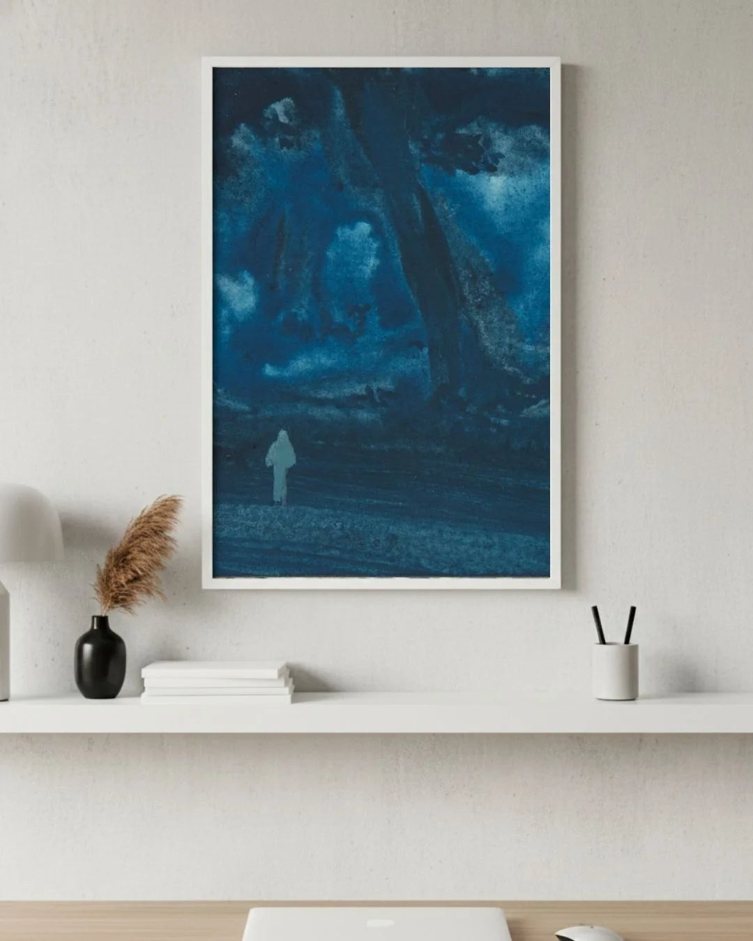 Bireswar Das "The Eternal Peaks" Himalayan landscape in a 0.5-inch Moon White frame, styled above a white minimalist desk with pampas grass.