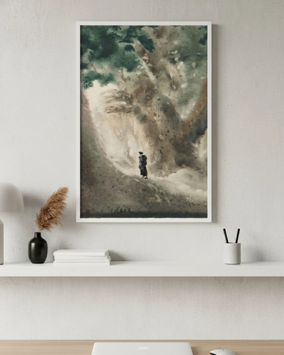 Bireswar Das "The High Altitudes" Himalayan landscape in a 0.5-inch Moon White frame, styled above a white minimalist desk with pampas grass.