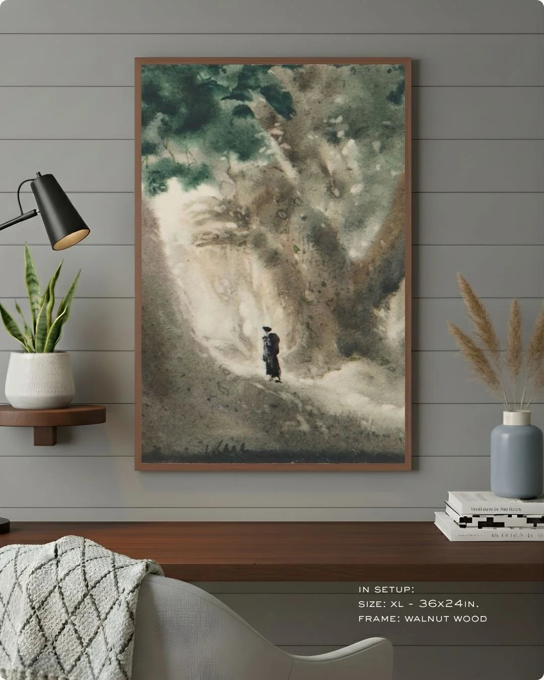 Bireswar Das "The High Altitudes" in a warm Walnut Wood frame by K2C Co., styled against a grey wood-paneled wall for a grounded, executive professional look.