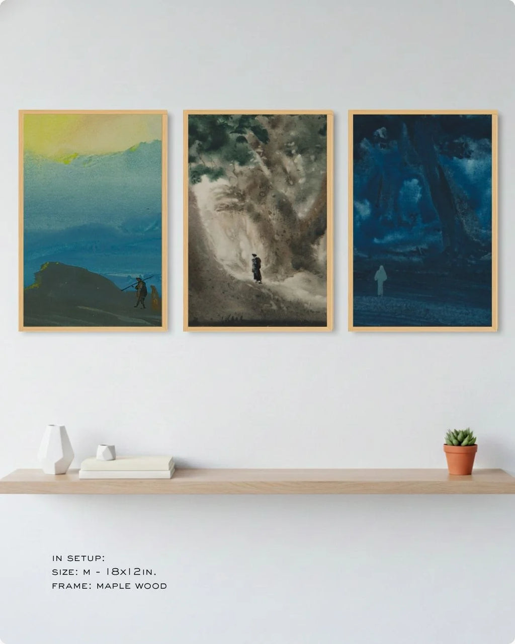 Organic modern styling of the Bireswar Das 3-piece gallery set in natural Maple Wood frames, displayed above a light wood floating shelf with small indoor plants.