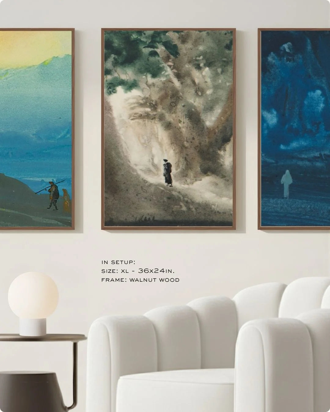 Large-scale (Size XL) Bireswar Das 3-piece Himalayan triptych in 0.5-inch Walnut Wood frames, styled above a white curved sofa in a minimalist living room.