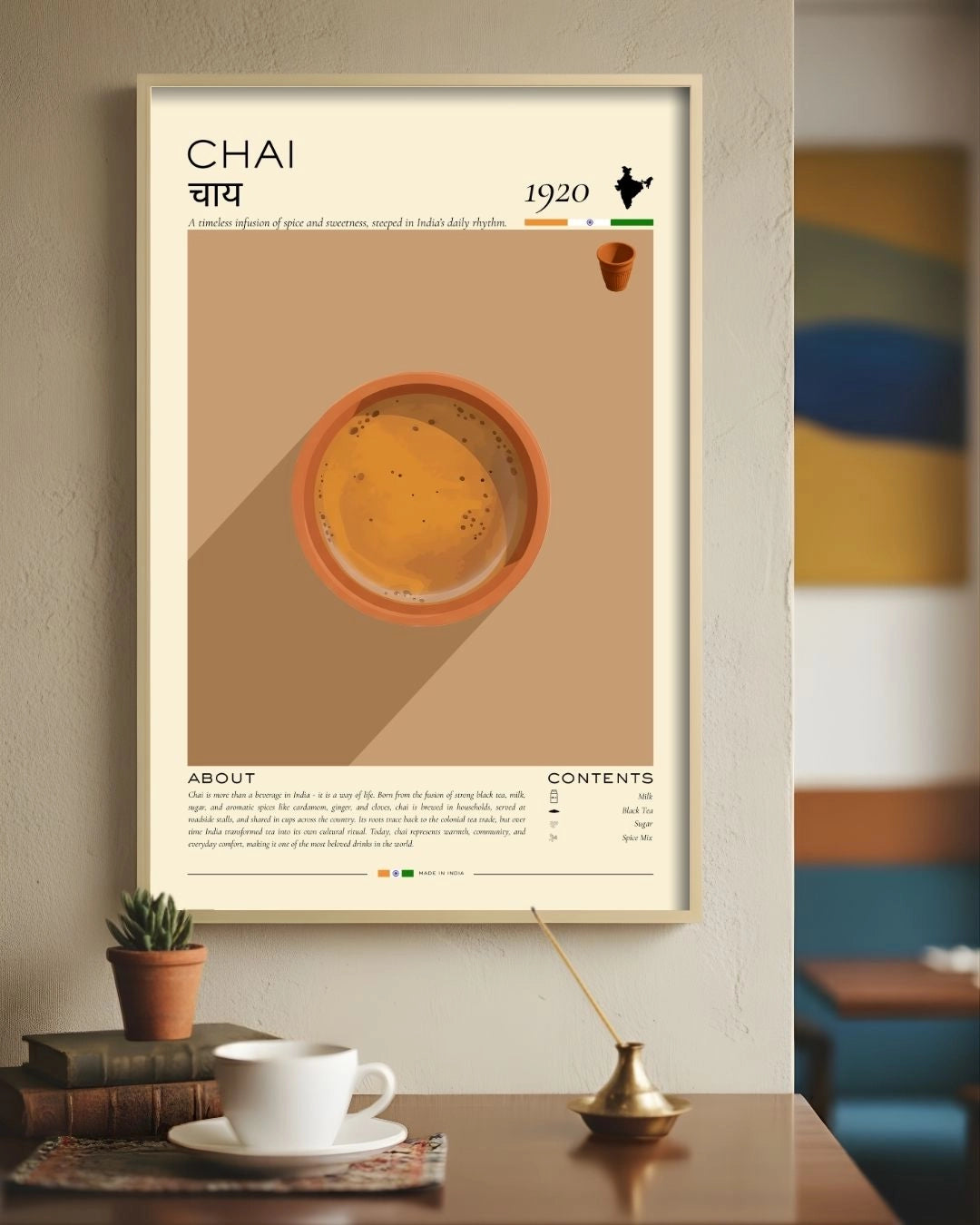 Minimalist Chai Rituals infographic by K2C Co. in a Maple Wood frame, styled in a cozy study corner with a tea cup, books, and incense for a "slow living" aesthetic.