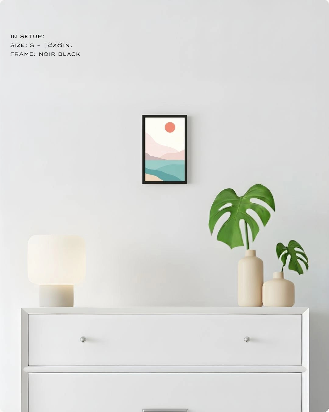 Small (Size S) Coastal Serenity minimalist landscape print by K2C Co. in a Noir Black frame, displayed on a bedroom wall above a white dresser for small-space styling.