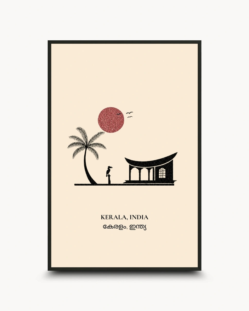 A framed minimalist art print of Kerala, India, featuring a black silhouette of a palm tree, a temple, and a figure under a red sun on a cream background, enclosed in a thin black frame.