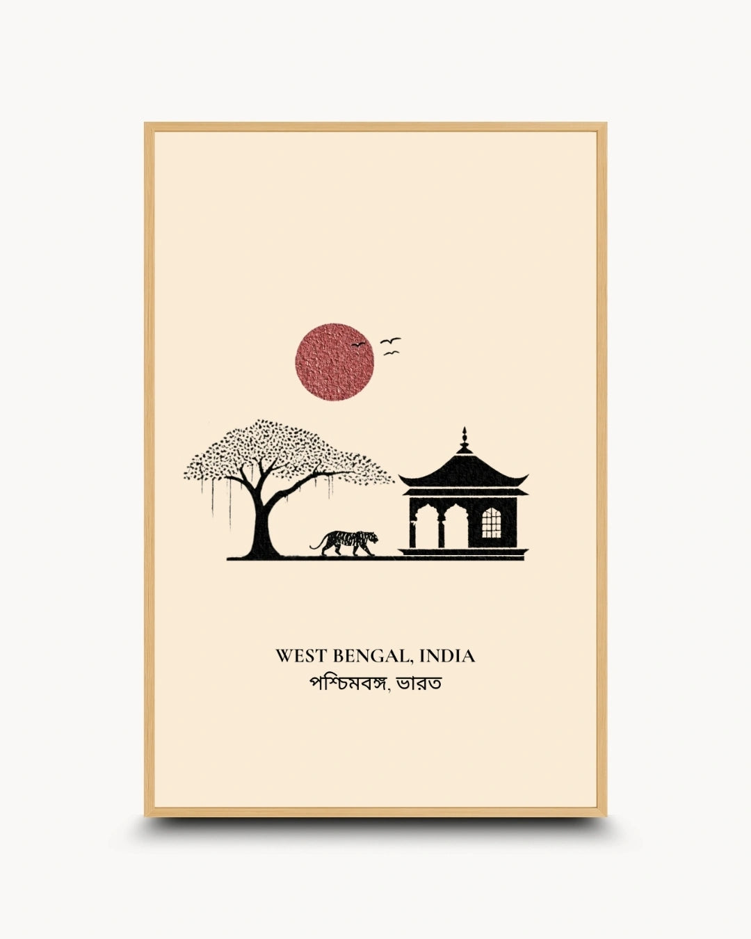 A framed art print featuring a minimalist illustration of West Bengal, India, with a black silhouette of a tree, a pagoda, an elephant, and a red sun on a cream background, enclosed in a light wood frame.
