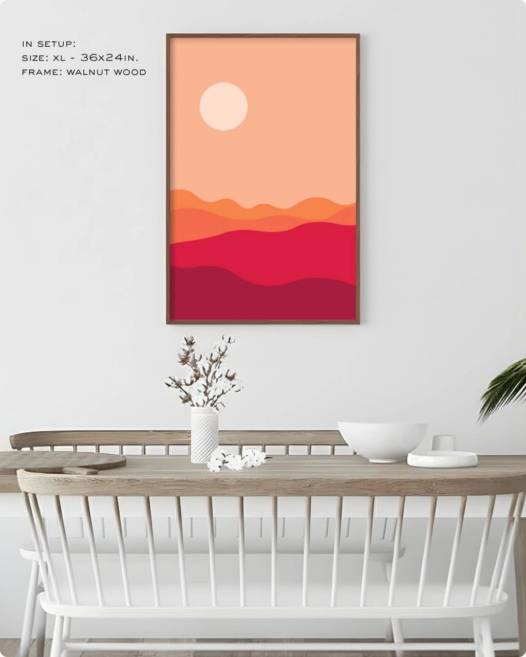 K2C Co. Desert Dusk abstract landscape artwork in a Walnut Wood frame, displayed in a bright modern dining room setting with minimalist white furniture.