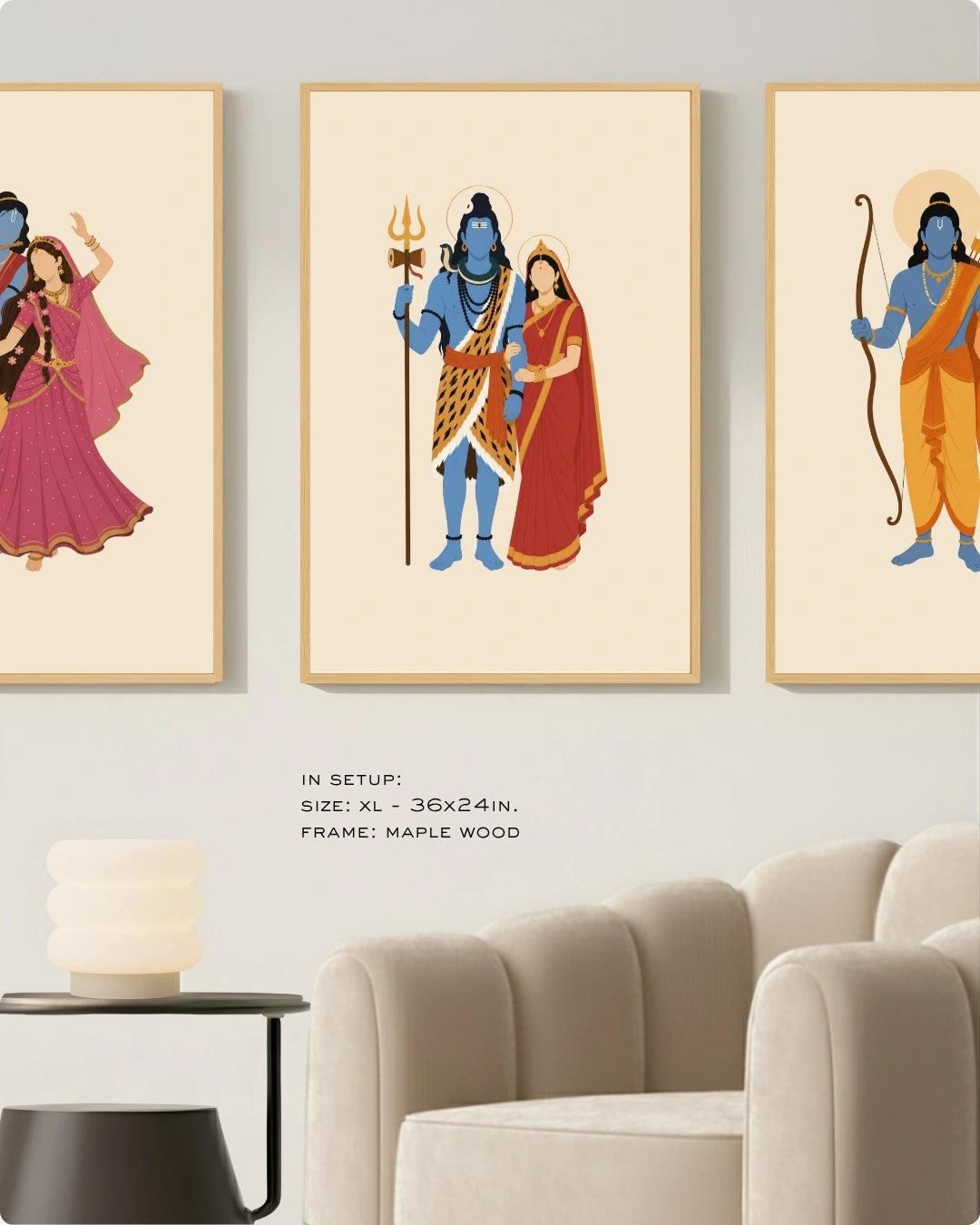 Visual size guide mockup for the Hindu divine couples wall art set of 3 in Extra Large size with maple wood frames, shown scaled perfectly next to a contemporary beige armchair.