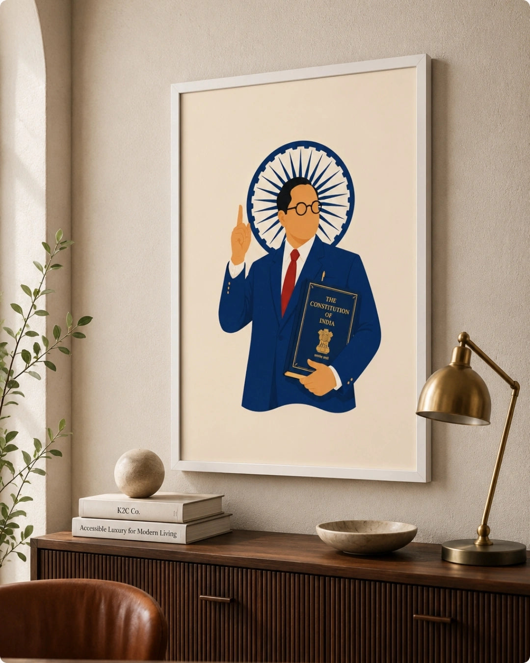 Lifestyle interior mockup of the Dr. B.R. Ambedkar wall art in a clean white frame hung over a wooden credenza next to a classic brass desk lamp.