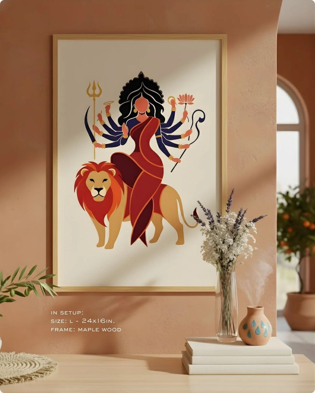 Close-up of the Durga divine illustration in a Satin Gold frame, showcasing the vibrant red and gold against an earthy neutral wall.