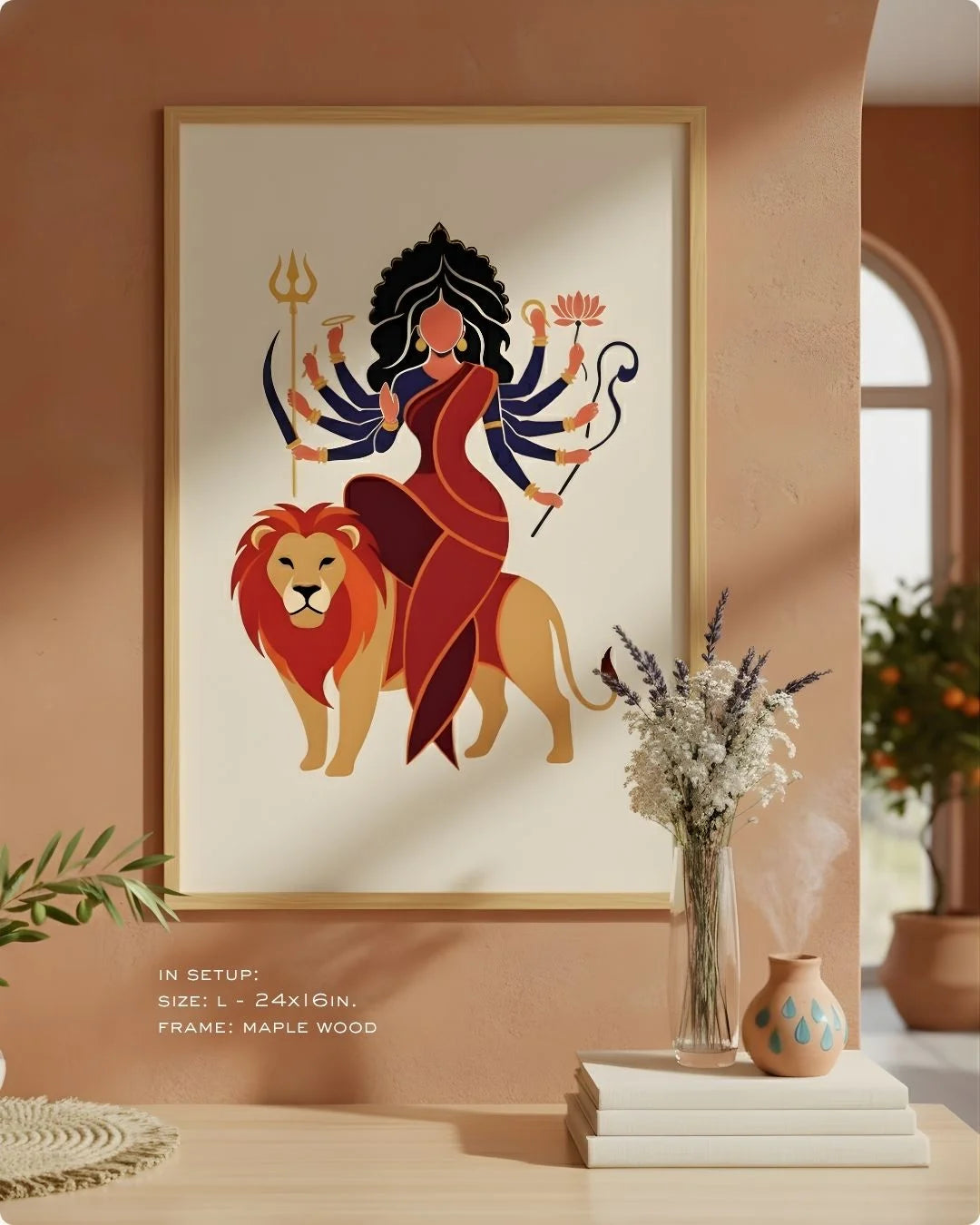 Close-up of the Durga divine illustration in a Satin Gold frame, showcasing the vibrant red and gold against an earthy neutral wall.