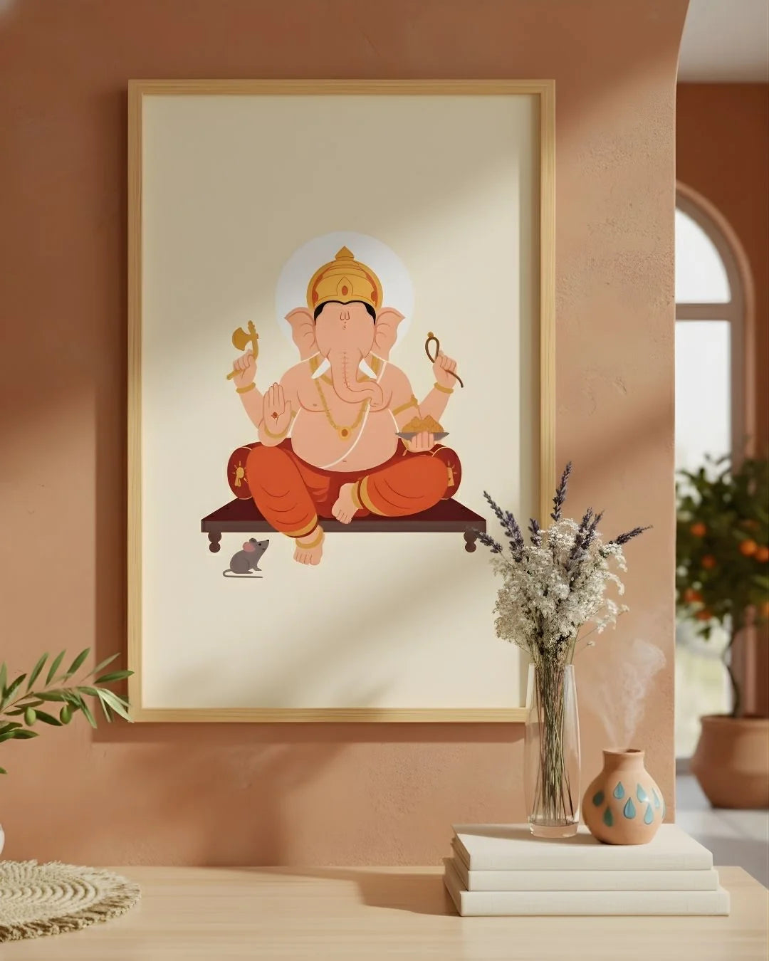 Lord Ganesh minimalist print in a 0.5-inch Satin Gold frame, styled in a warm terracotta room with dried lavender and books.