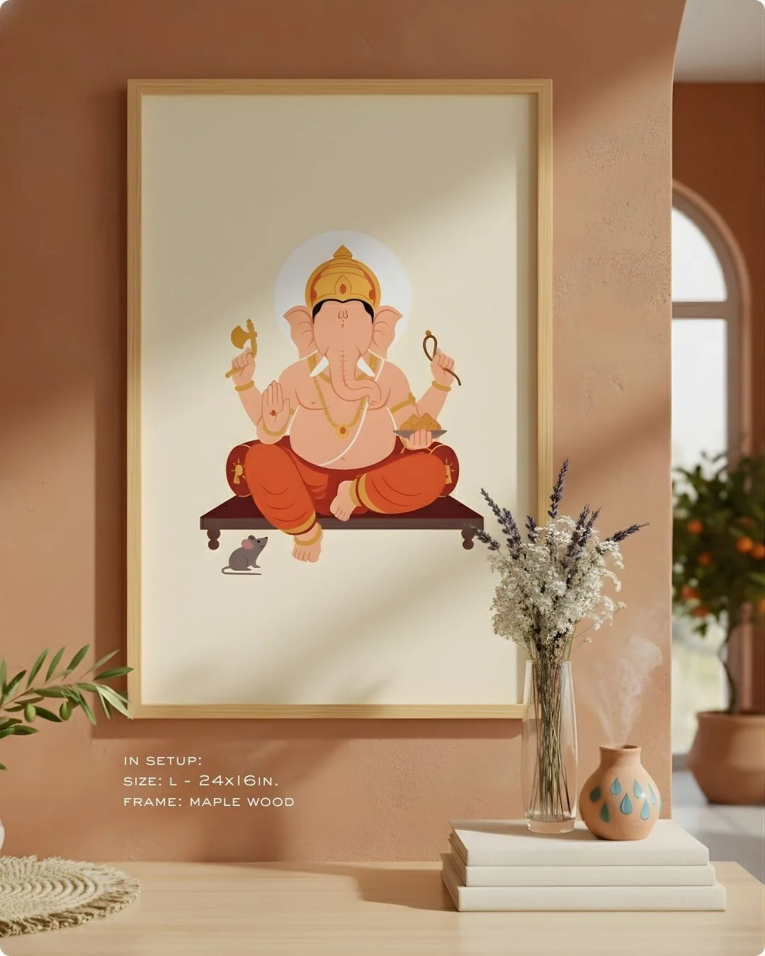 Close-up of the Ganesha divine illustration in a Satin Gold frame, showcasing the vibrant orange and gold motifs against an earthy neutral wall.