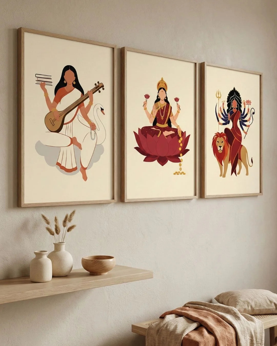 3-piece minimalist Hindu goddess wall art set in Maple Wood frames, styled in a serene organic bedroom with neutral textures.