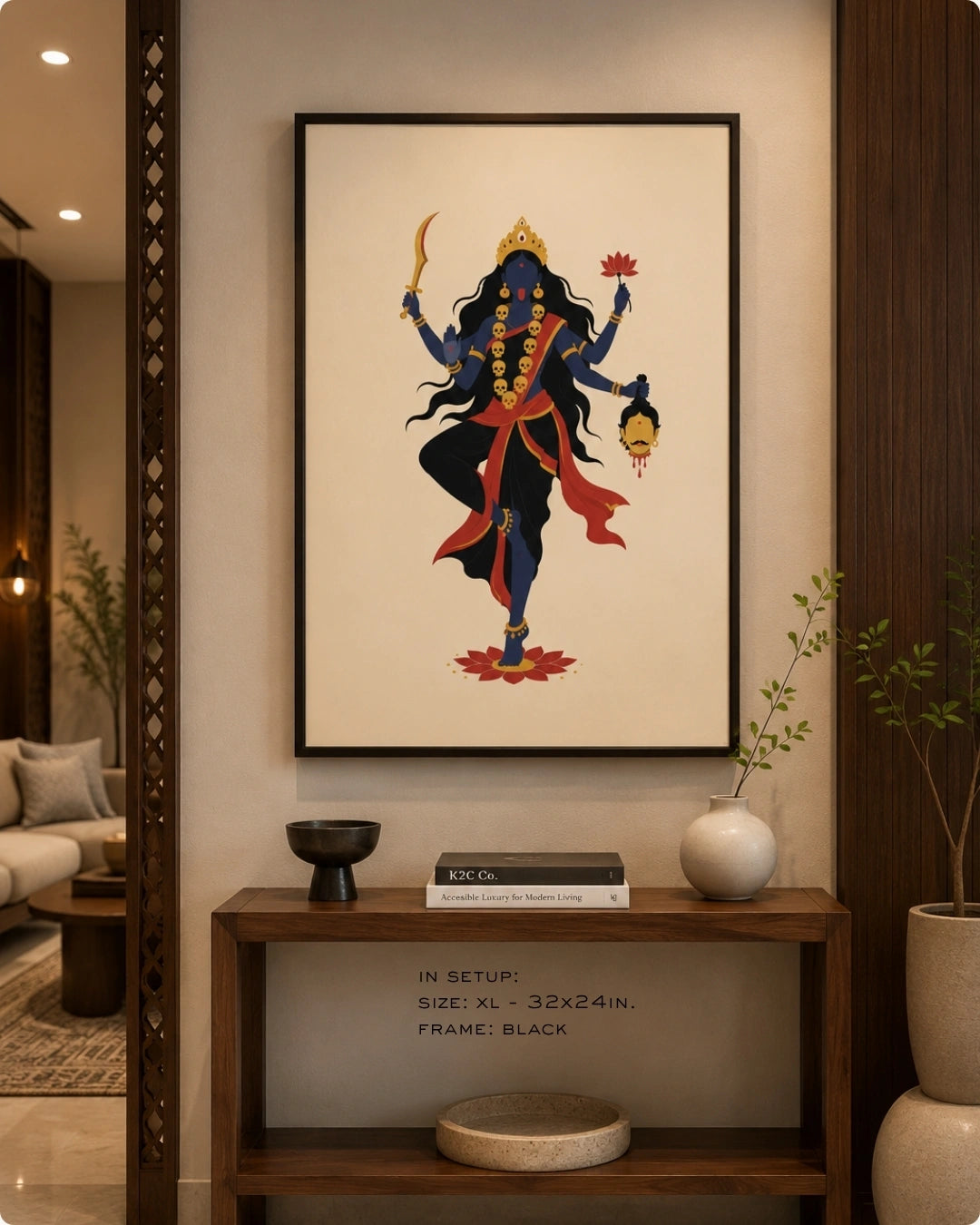 Lifestyle mockup of the minimalist Hindu Goddess Kali wall art in a sleek black frame, hung above a modern dark wood console table with contemporary accents.