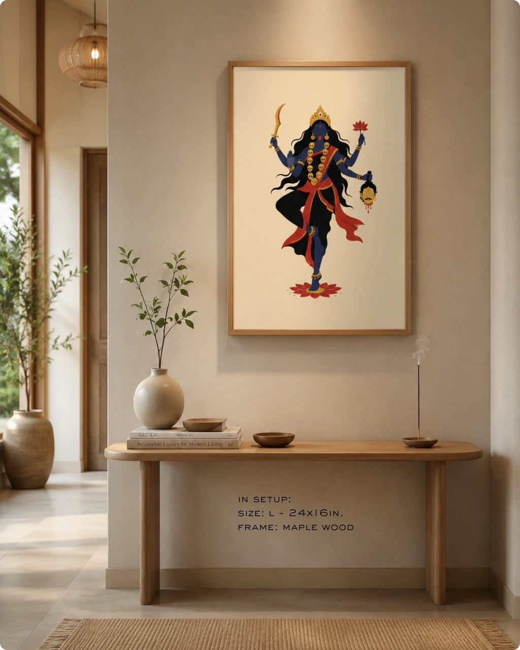Lifestyle mockup of the minimalist Hindu Goddess Kali wall art in a maple wood frame, styled above a light wood Japandi console table.