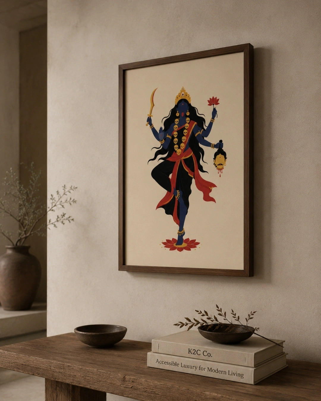 Lifestyle mockup of the minimalist Hindu Goddess Kali wall art in a walnut wood frame, styled above a clean wooden bench in a bright, modern entryway.