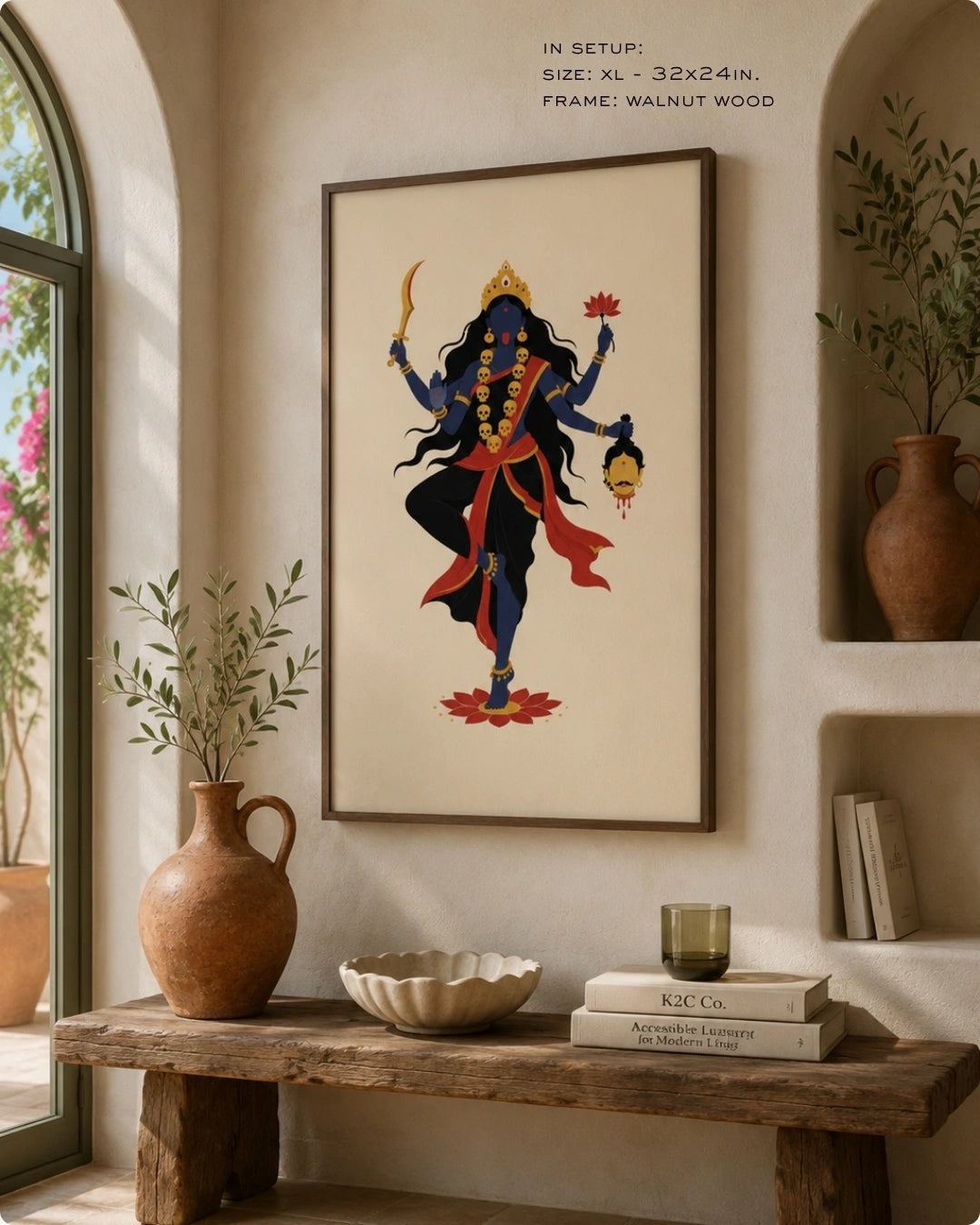 Lifestyle interior mockup of the Hindu Goddess Kali wall art in a rich walnut wood frame, paired with wabi-sabi elements like textured pottery and a rustic wooden bench.