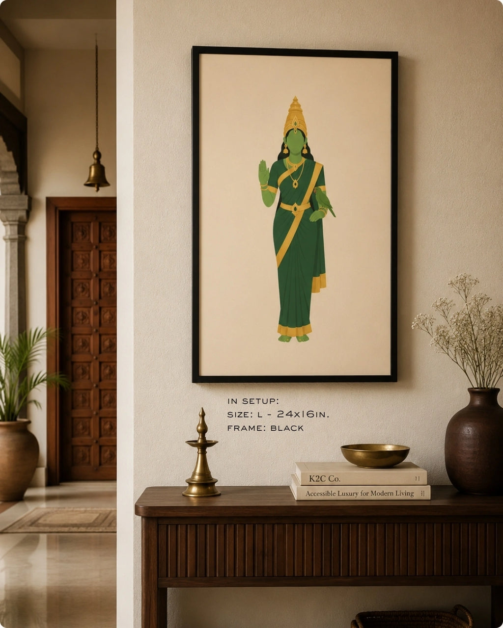 Lifestyle interior mockup of the Hindu Goddess Meenakshi wall art in a sleek black frame, hung above a dark traditional wood console adorned with antique brass decor.