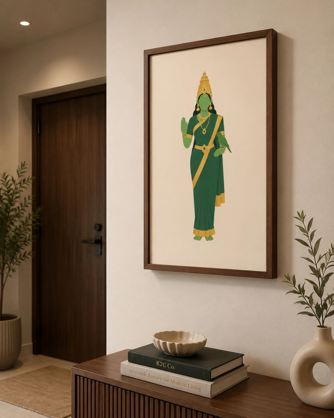Lifestyle mockup of the minimalist Hindu Goddess Meenakshi wall art in a rich walnut wood frame, perfectly centered above a clean floating wooden console in a contemporary hallway.