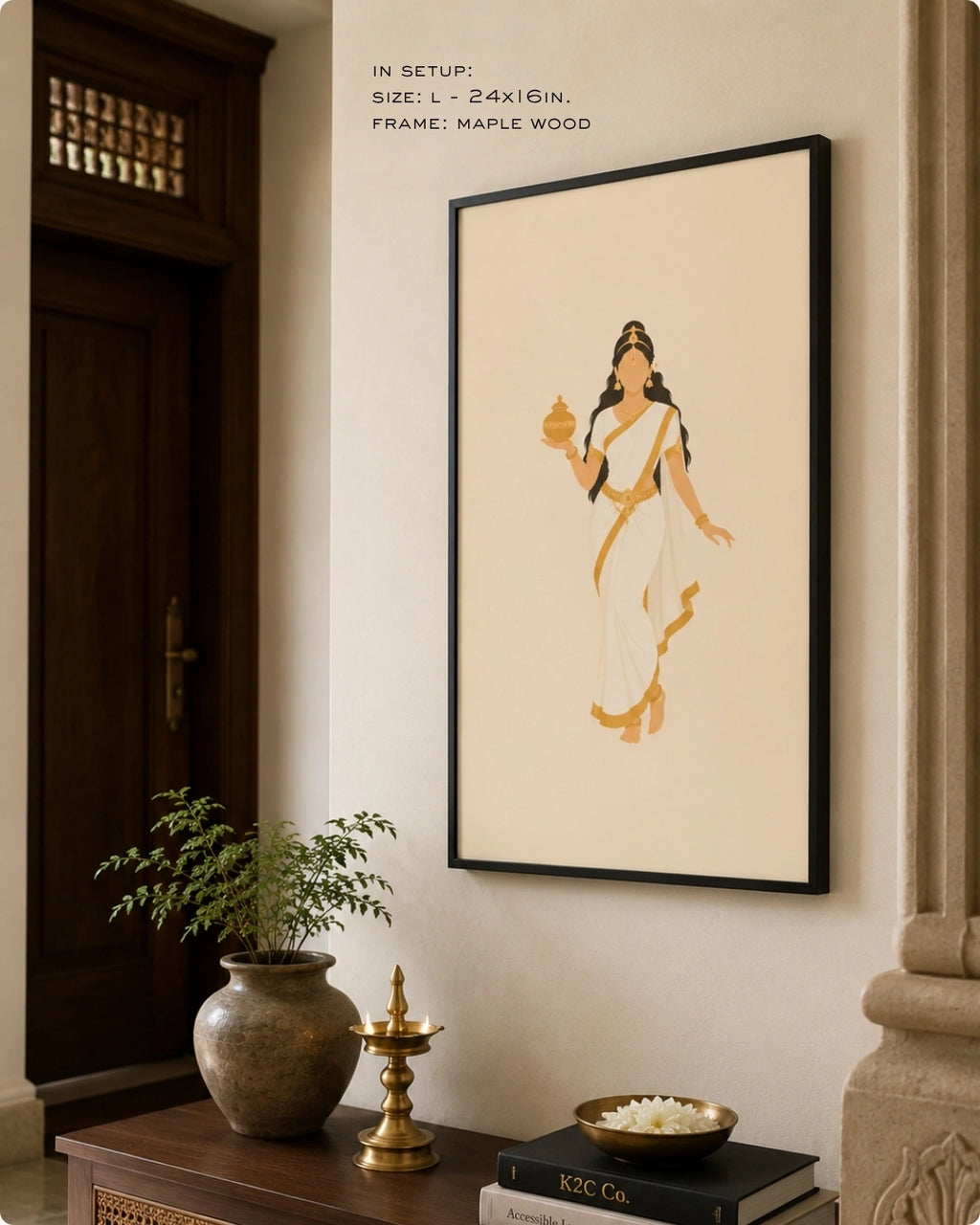 Lifestyle interior mockup of the Hindu Goddess Mohini wall art in a sleek black frame, hung near a dark wooden doorway above a traditional console adorned with brass decor.