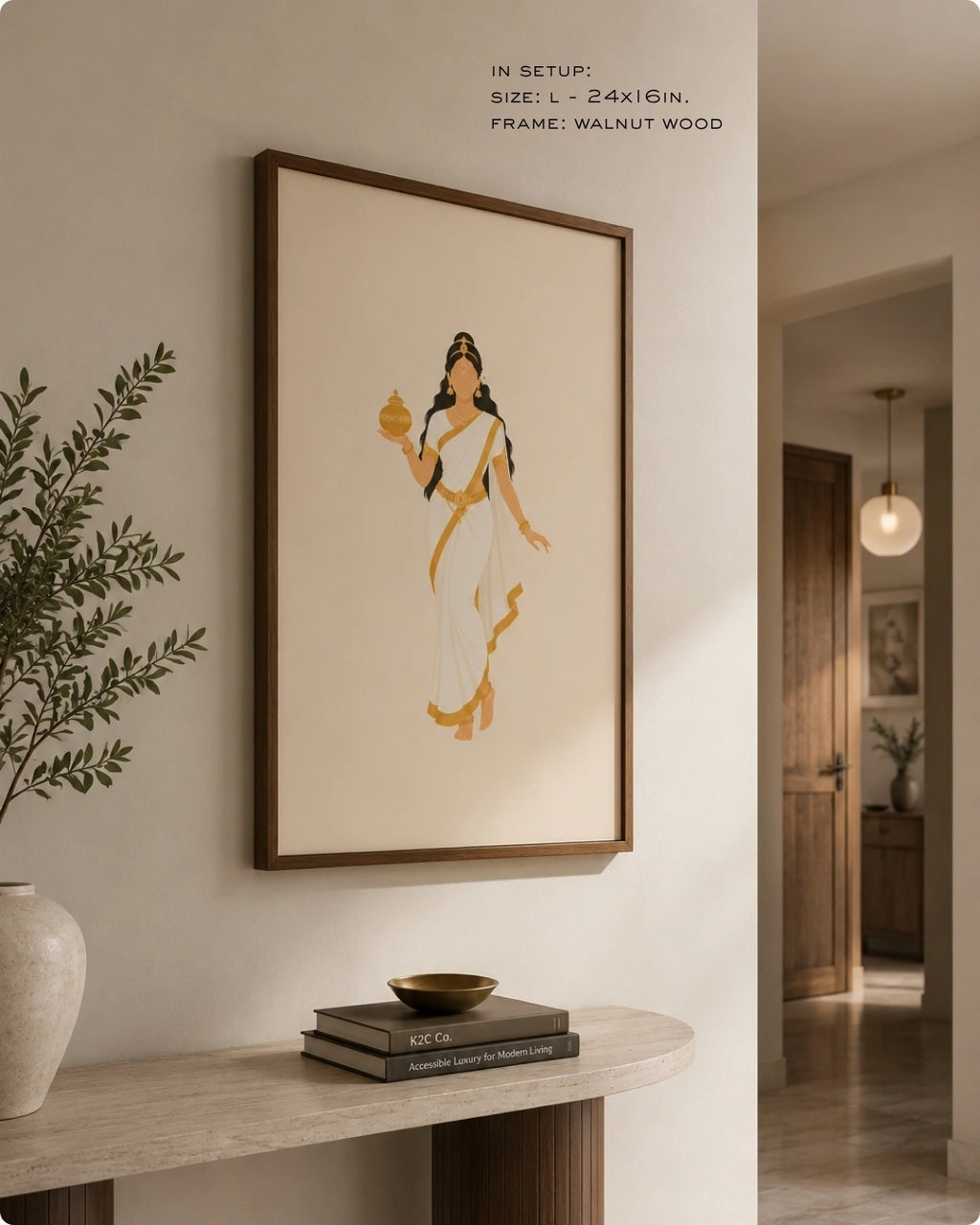 Lifestyle mockup of the minimalist Hindu Goddess Mohini wall art in a rich walnut wood frame, styled above a curved dark wood console with natural pottery.