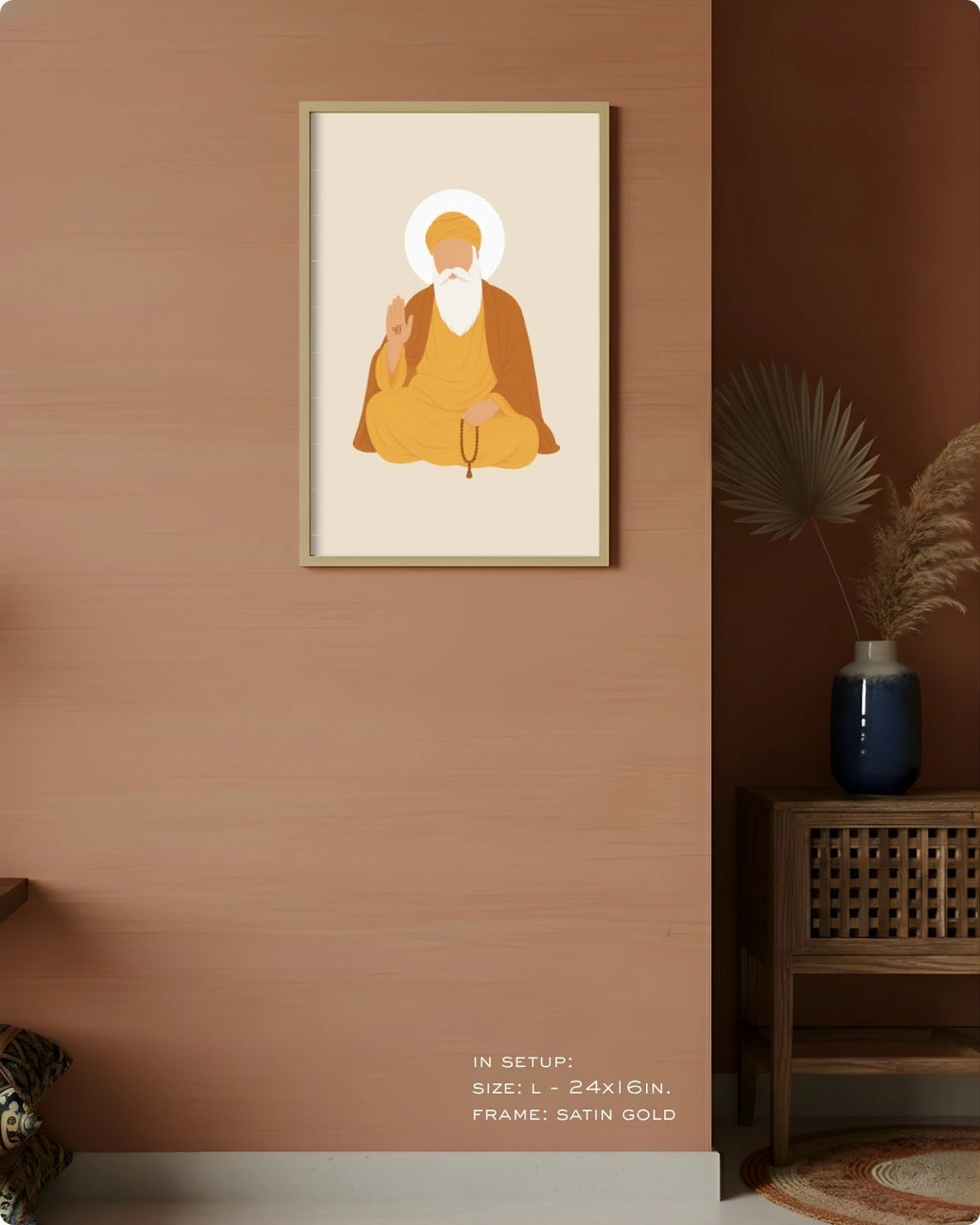 Visual size guide mockup for the Sikh founder Guru Nanak Dev Ji wall art in Large size with a satin gold frame, displayed against a warm terracotta accent wall.
