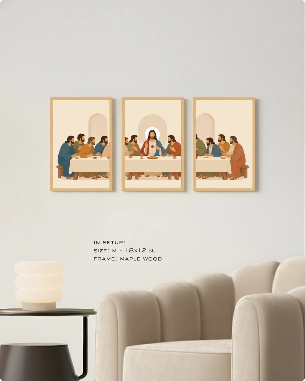Three framed art prints depicting a stylized scene of figures around a table, displayed on a light gray wall above a beige armchair and side table. Text below reads: 'IN SETUP: SIZE: M - 18x12 IN.