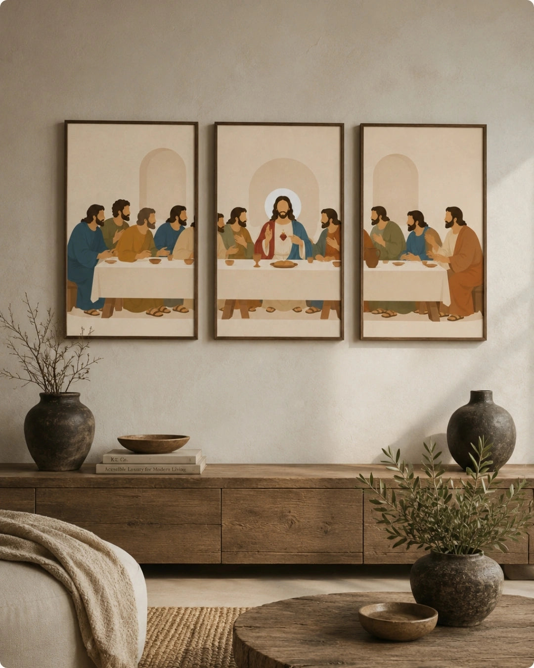 Three framed vertical art prints depicting a stylized Last Supper scene, displayed side-by-side on a textured beige wall above a rustic wooden console table with decorative vases and plants.