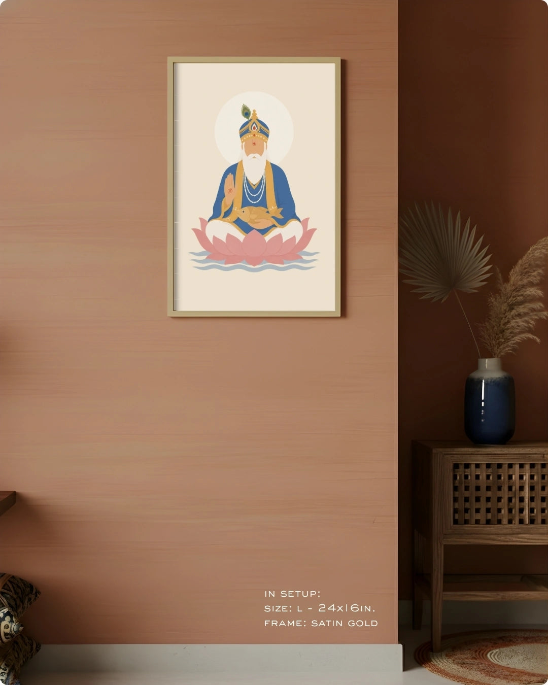 Visual size guide mockup for the Lord Jhulelal wall art in Large size with a satin gold frame displayed against a warm terracotta accent wall.