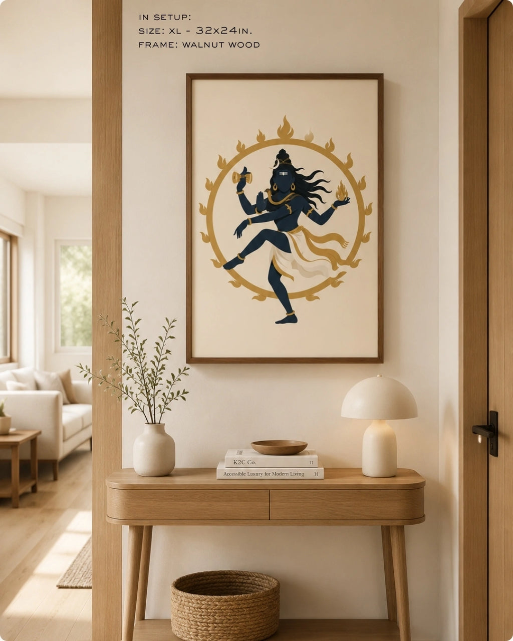 Lifestyle mockup of the minimalist Hindu deity Lord Nataraja wall art in a maple wood frame, displayed over a clean light wood console table with a soft glowing table lamp.