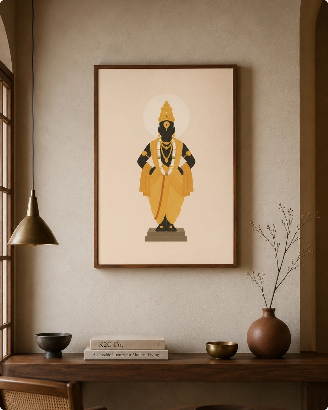 Lifestyle mockup of the Lord Vitthal wall art in a rich walnut wood frame styled next to a hanging brass pendant lamp over a dark wooden ledge.