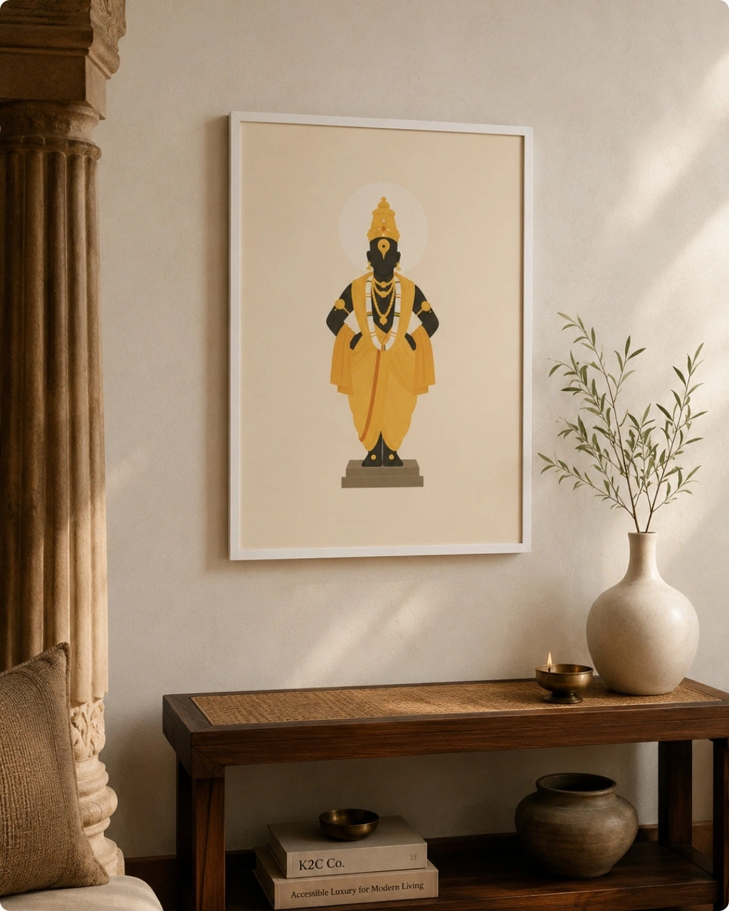Lifestyle interior mockup of the Lord Vitthal wall art in a clean white frame hung over a rustic wooden bench beside classic carved pillars.