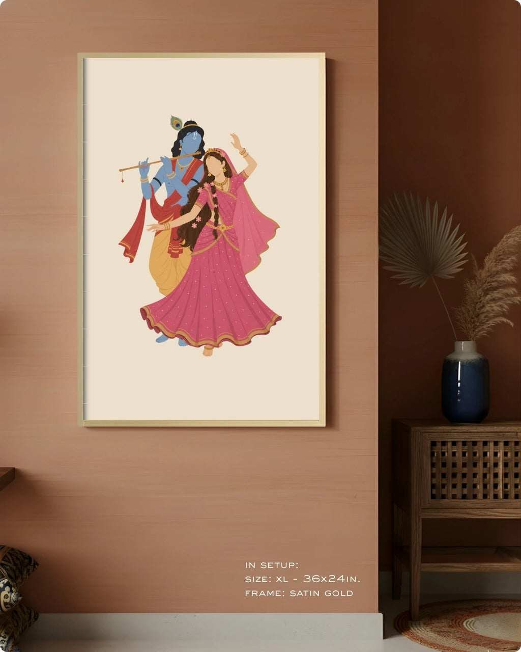 Visual size guide mockup for the Hindu divine couple Radha and Krishna wall art in Extra Large size with a satin gold frame, displayed against a warm terracotta accent wall.