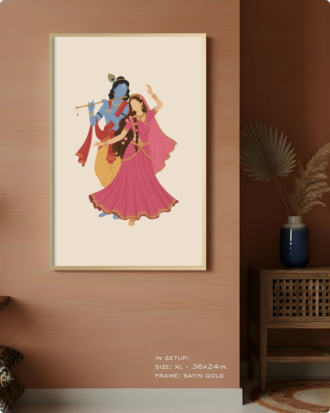 Visual size guide mockup for the Hindu divine couple Radha and Krishna wall art in Extra Large size with a satin gold frame, displayed against a warm terracotta accent wall.